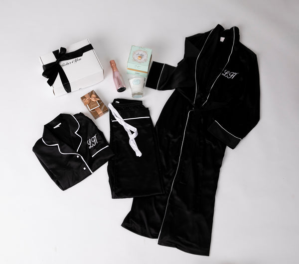 Long Luxurious Silky feel full lenght black satin robe with piping with Matching Pyjamas with chocolates, champagne, candle all presented in a gift box